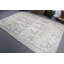 Découvrez le charme d'un tapis turc rétro à motif floral authentique dans des tons pastel doux
