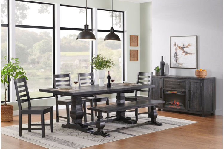 modern dining room with a dark gray table and chairs and matching ventless fireplace