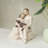 Couples Sit On Stools Holding Dogs