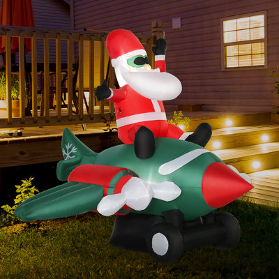 Décoration de Noël gonflable de 7,3 pi de long avec un père Noël volant d'un avion, lumières DEL pour une présentation festive
