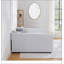 Grand lit beige avec rangement spacieux, parfait pour le confort et l'organisation moderne de la chambre à coucher