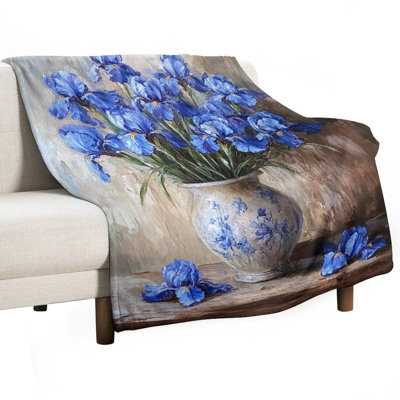 Jeté bleu iris dans un vase en porcelaine sur jeté en flanelle de luxe