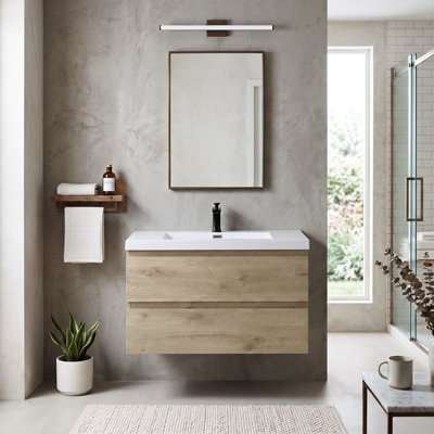 Meuble-lavabo suspendu en mélamine de bois de 35,43 po avec portes à fermeture amortie et lavabo intégré en résine, entièrement assemblé.