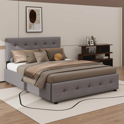 Grand lit plateforme avec deux compartiments de rangement sous le lit et un lit gigogne supplémentaire