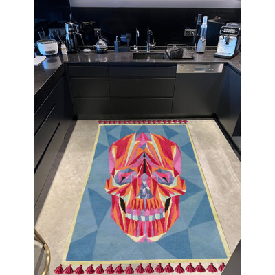 Tapis tissé multicolore à franges