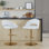 Tabouret de bar réglable avec pivot en métal doré et similicuir blanc avec repose-pieds rond en T - ensemble de 2