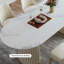 Table de salle à manger blanche et blanche en pierre frittée ovale et cristal