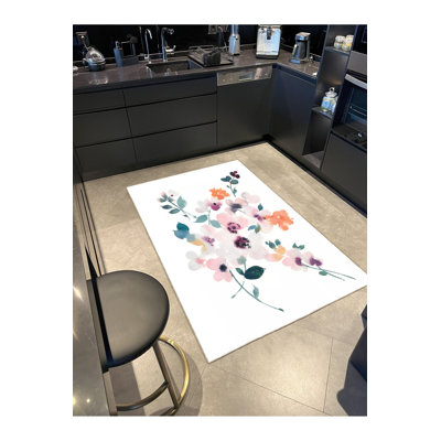 Tapis floral lavable coloré à base tissée
