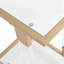 Versatile square table with glass top and metal base for multiple spaces