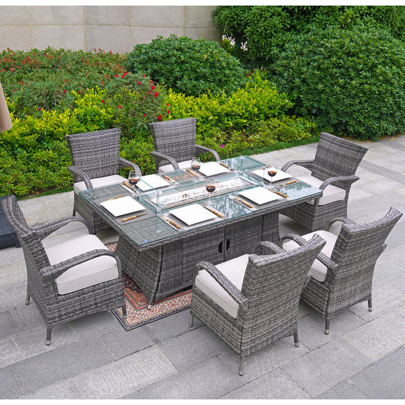 Omied 6 - Person Wicker Patio Dining Set with Rectangular Table , Cushions Included