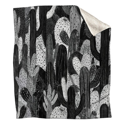 Couvertures noires, blanches et cactus