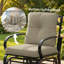 Fauteuil oscillant d'extérieur beige avec coussins et structure en acier inoxydable