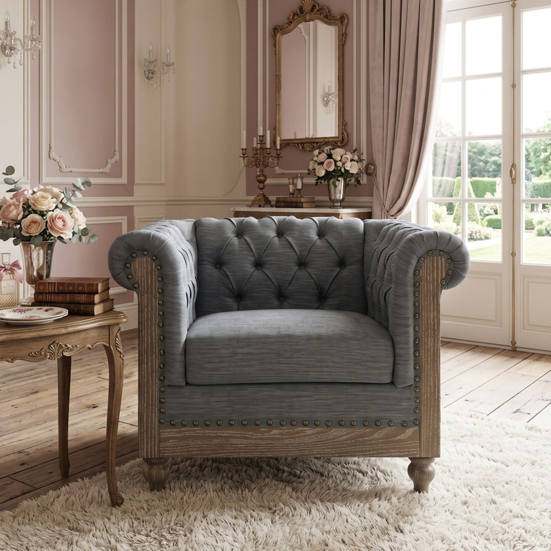 Fauteuil club capitonné d'inspiration Chesterfield avec accoudoirs