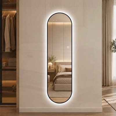 Miroir mural pleine longueur à DEL à forme de capsule et à intensité variable avec cadre noir, parfait pour un décor moderne et élégant