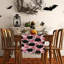 Chemin de table d'Halloween avec chat noir et citrouilles roses