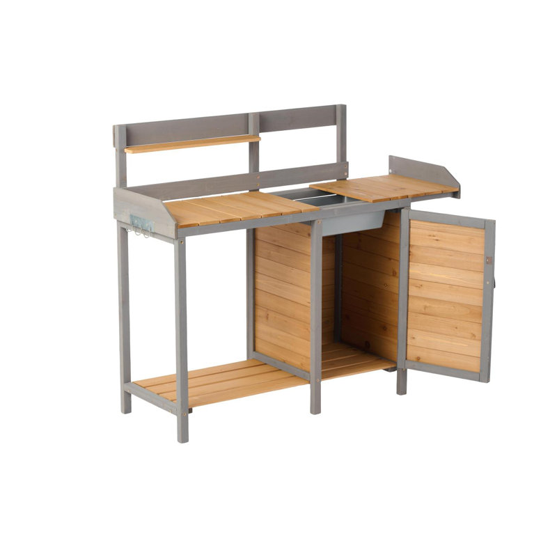 Banc d'extérieur en bois avec évier et rangement pour le jardinage
