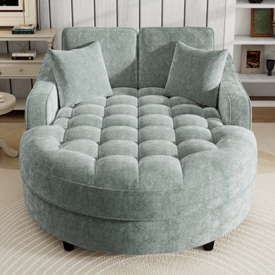 Canapé-lit moderne et confortable avec siège capitonné et coussins amovibles, idéal pour relaxer et améliorer les espaces de vie