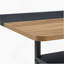 Table de salle à manger spacieuse en bois et noire avec rangement et 8 confortables chaises en polyuréthane gris clair, parfaites pour les réunions de famille et les réunions de société.