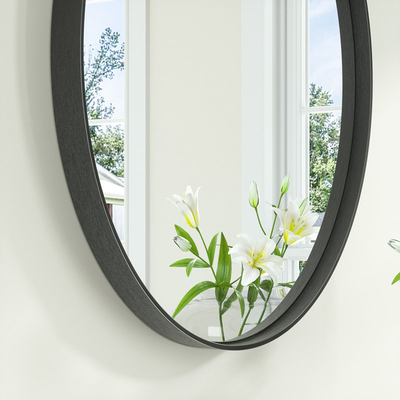 Miroir de salle de bain mural ovale en métal incurvé moderne Juriana, H 24 po x l 36 po x P 2 po, Noir