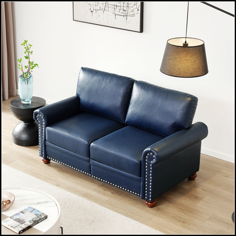 Canapé de salon moderne en similicuir avec rangement, alliant confort et style pour un espace sans encombrement.