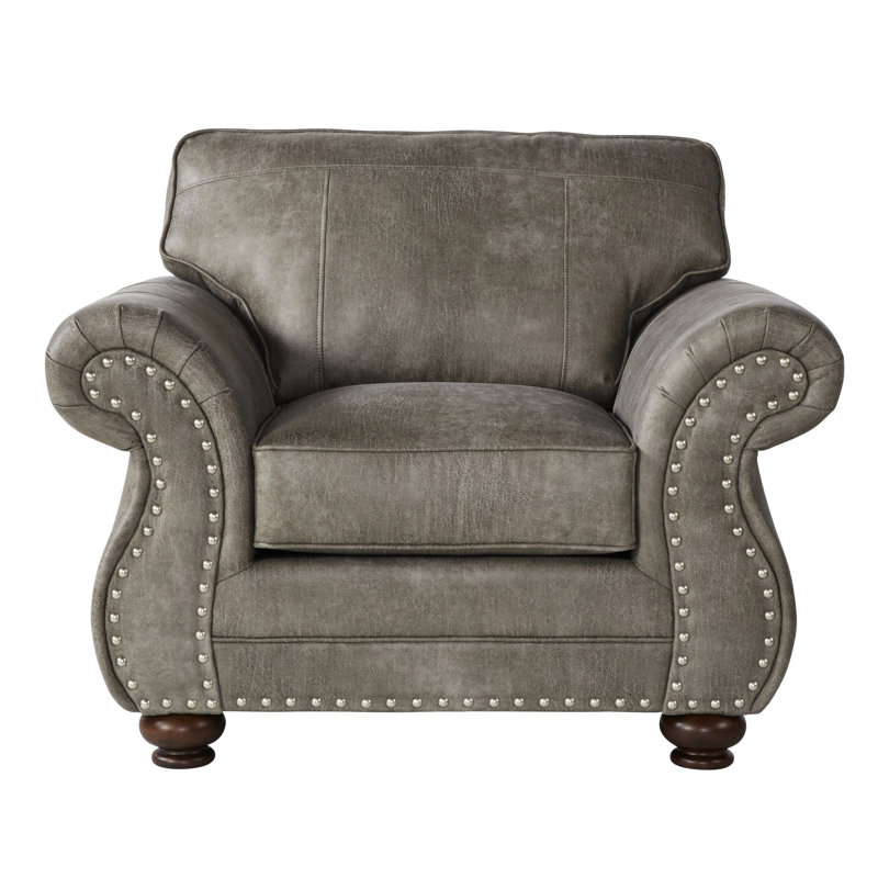 Chaise grise en similicuir gris avec magnifique coussin de dossier dans des matériaux de qualité