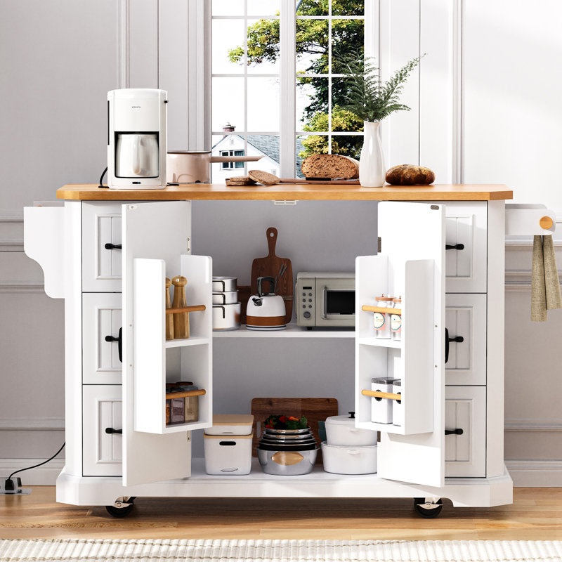 Îlot de cuisine avec abattant, prise de courant, tablettes et tiroirs sur roulettes pour un rangement polyvalent et pratique