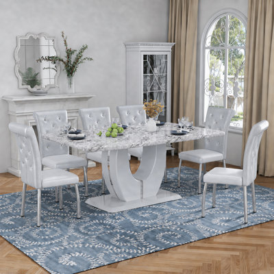 Ensemble de table de salle à manger moderne en faux marbre de 63 po avec chaises en similicuir à ressorts