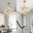 7-Light 23.6'' Dimmable Modern Gold Tree Branch Chandelier with Ceramic Ginkgo Leaf