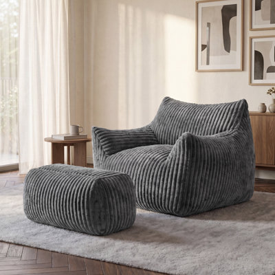 Pouf rembourré en velours côtelé avec repose-pieds