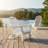 The Adirondack Chair, Made Of White Wood-Grain Composite Material, Features A Foldable Design And Comes With Double Cup Holders, Offering Both Comfort And Practicality.-528695132