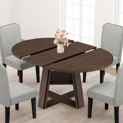 Table de salle à manger extensible ronde à ovale, piètement en bois avec tablette de rangement