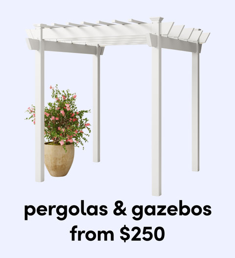 A white freestanding garden pergola positioned over a large potted plant with pink flowers from $250.