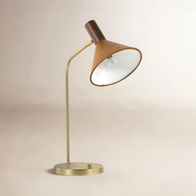 Ceramic-based table lamp with a fabric shade photographed for a retailer product listing