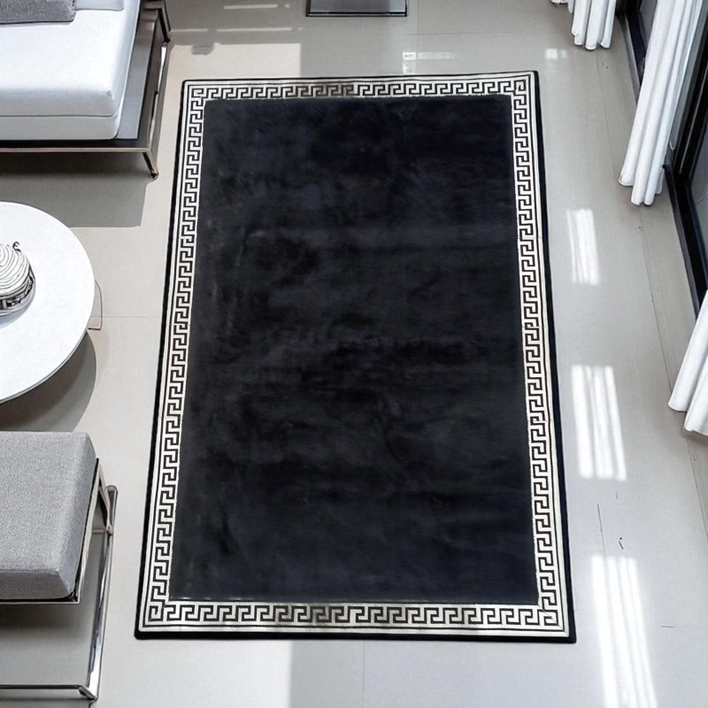 Élégant tapis moelleux noir avec bordure argentée