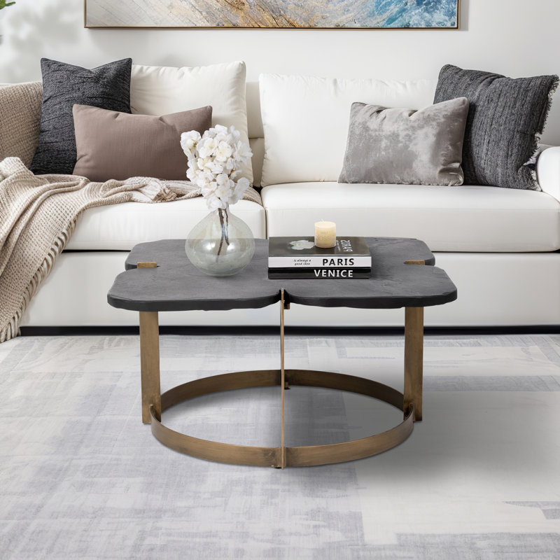 Beccaro Modern Black Stone Coffee Table with Antique Brass Iron Base and Sculpted Four-Leaf Design
