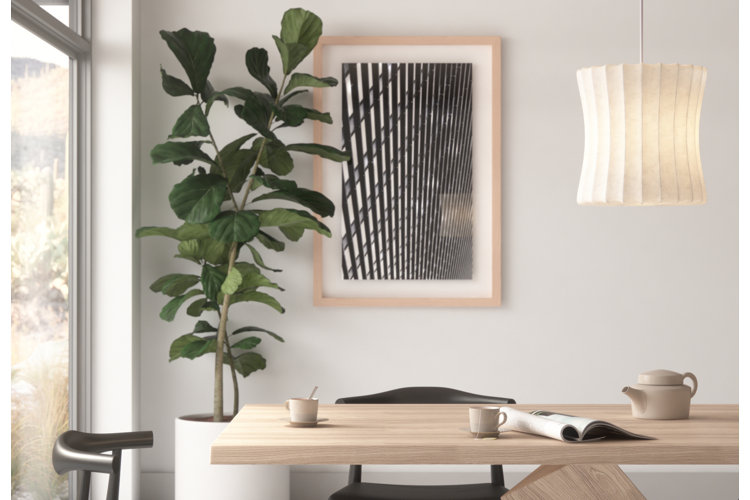 Dining room with abstract print on the wall.