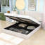Grand lit plateforme tapissier avec détails dorés et rangement caché-550126791