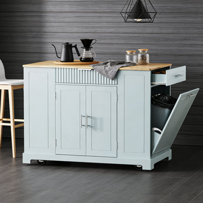 Fluted Kitchen Island with Trash Can Storage, Power Outlet, and Rolling Wheels for Modern Kitchens.