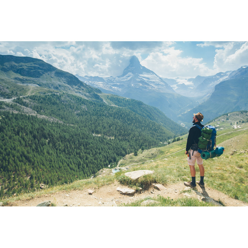 Hiker Looking At Matterhorn Mountain In The Distance by 4maksym - Wrapped Canvas Print, 30cm H x 46cm W
