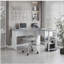 Bureau moderne en forme de L avec tablette latérale, gris