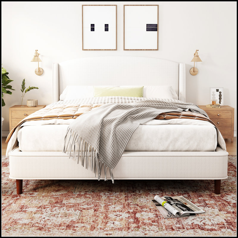 Lit plateforme tapissier avec tête de lit à oreilles, tissu doux et structure robuste pour un sommeil confortable et élégant