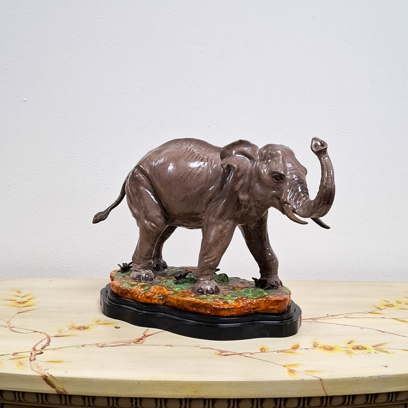 Porcelain Elephant Figurine With Bronze Tusks and Tail Accents On Wood Base