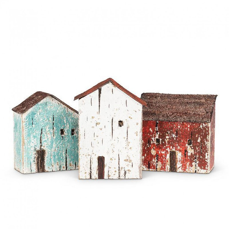 Mini figurine de maison blanche au bord de la mer avec toit rouge