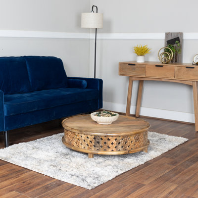 Handcrafted Round Mango Wood Coffee Table with Carved Lattice Base, 36" Wide, Natural Finish