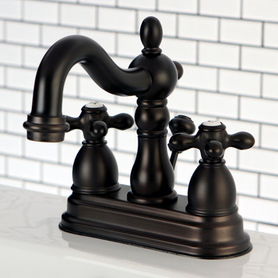 Kingston Brass Heritage Two-Handle 3-Hole Deck Mount 4" Centerset Bathroom Faucet with Brass Pop-Up