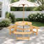 Table de pique-nique d'extérieur ronde avec bancs intégrés et trou pour parasol, idéale pour les repas sur la terrasse du jardin.