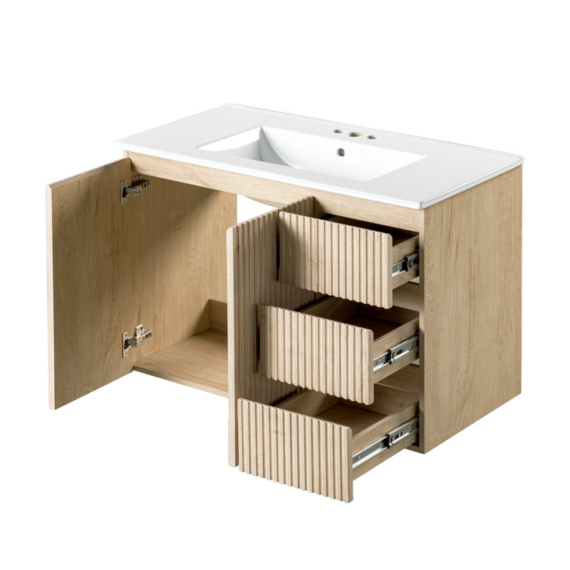 Meuble-lavabo mural de 91 cm (36 pouces) avec lavabo en céramique, 3 tiroirs à fermeture amortie, portes à fermeture amortie et poignées dissimulées.