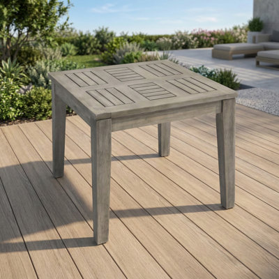 Outdoor side table crafted from acacia wood. Dimensions: 20 inches wide, 20 inches deep, 15.75 inches high. Hampton model.