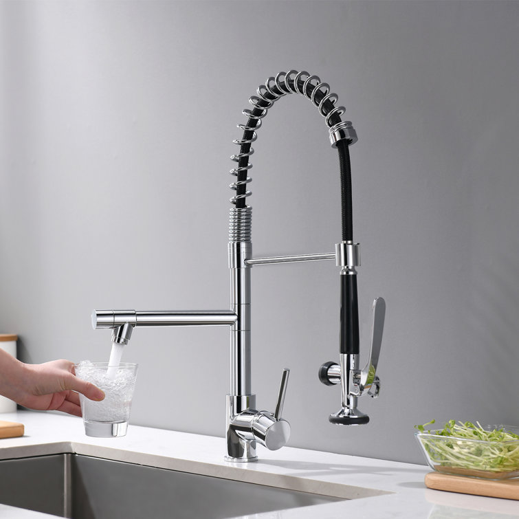 Kitchen water mixer. Water tap made of chrome material Stock Photo