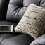 Causeuse-coussin modulable noire en cuir véritable